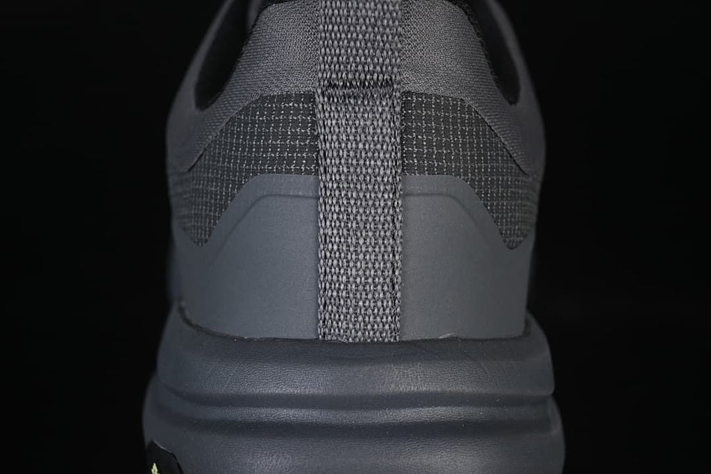 Rear view highlighting the heel pull tab and layered heel construction