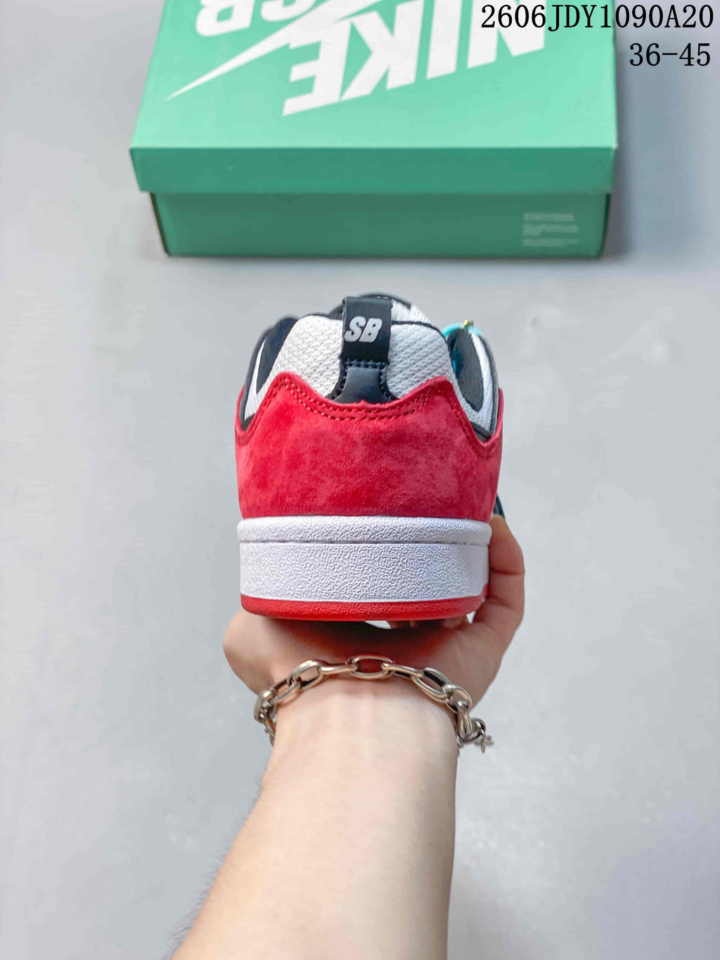 Rear view showing the red heel panel and white midsole of a Nike SB Alleyoop sneaker