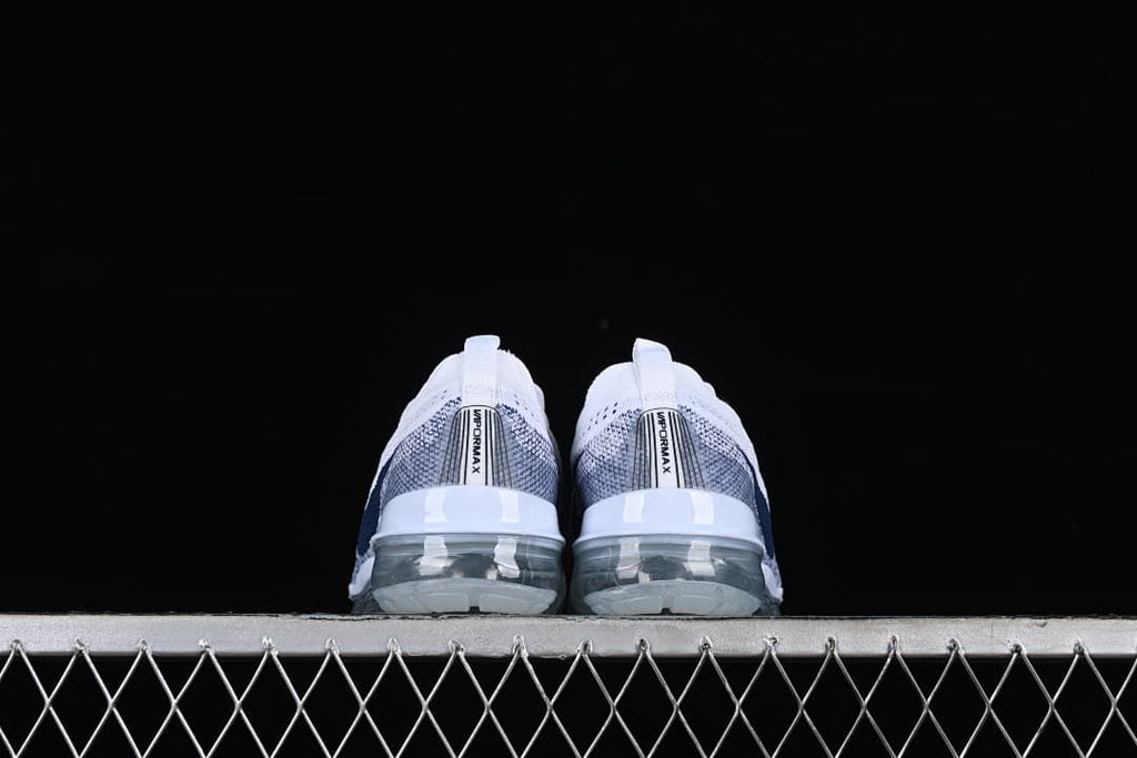 Rear view of both shoes showing the heel details and transparent soles