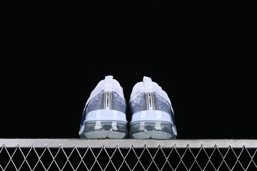 Rear view of both shoes showing the heel details and transparent soles