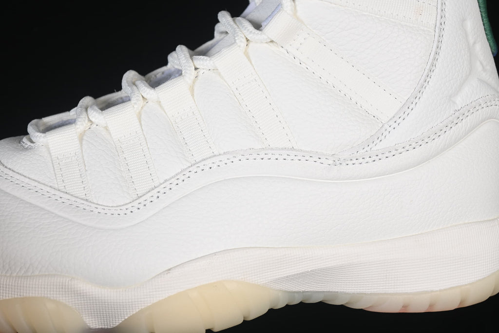 Close-up of the white upper, lace loops, and side stitching.