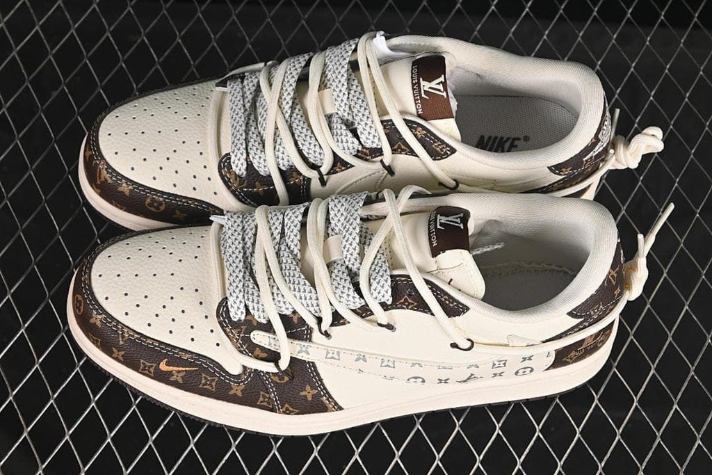 Top view of a pair of cream and dark brown low-top sneakers with contrasting laces and patterned panels