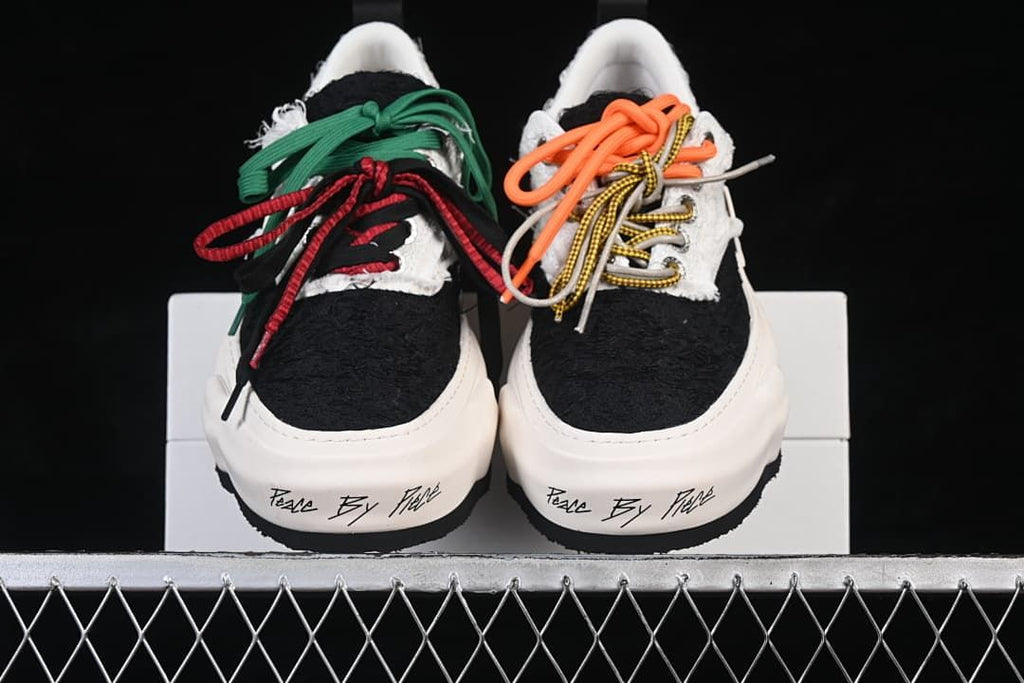 Front view of both sneakers with contrasting laces
