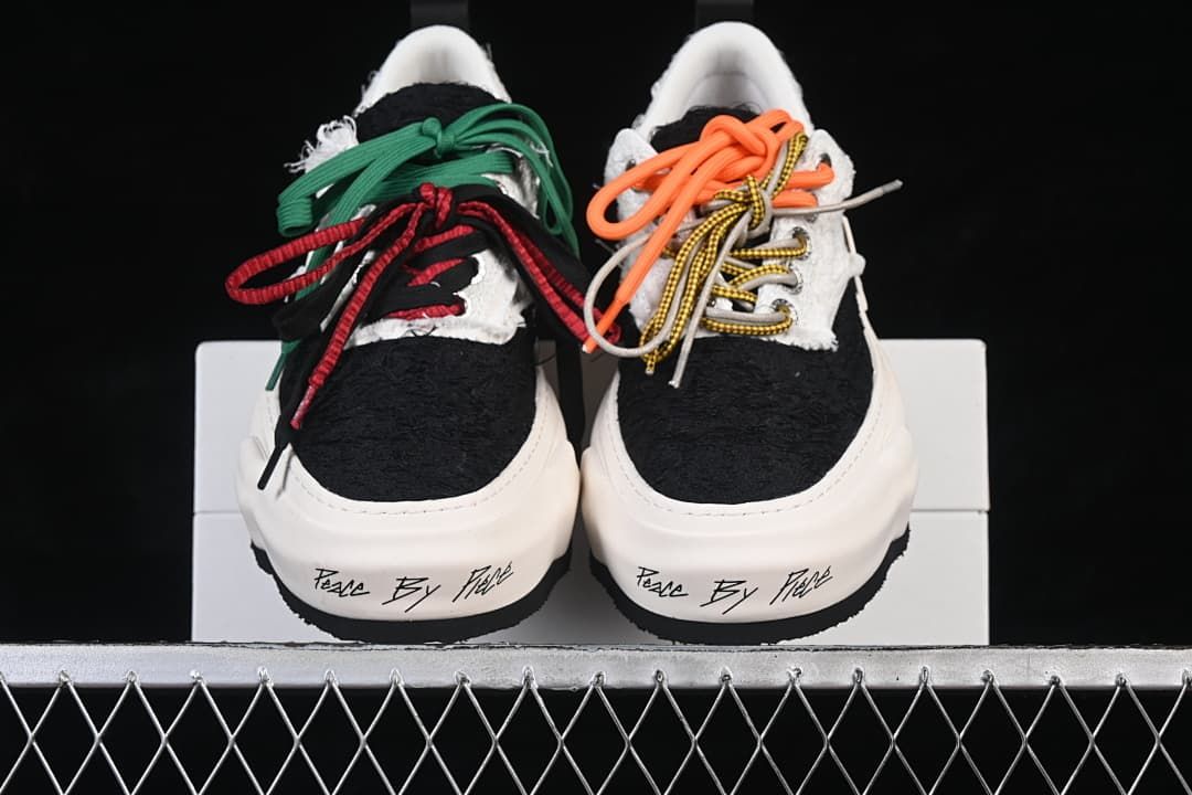 Front view of both sneakers with contrasting laces