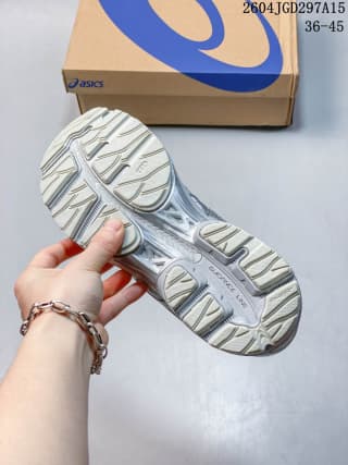 Underside view showing the segmented rubber outsole and traction pattern.