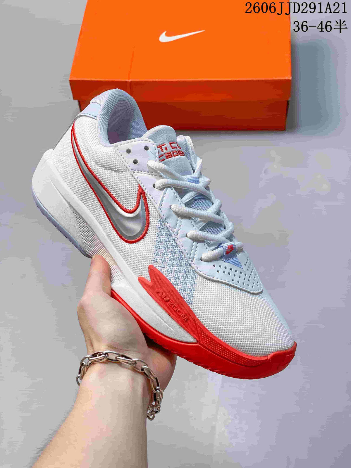 White Nike G.T. Cut 3 basketball shoe with red accents and a red outsole.