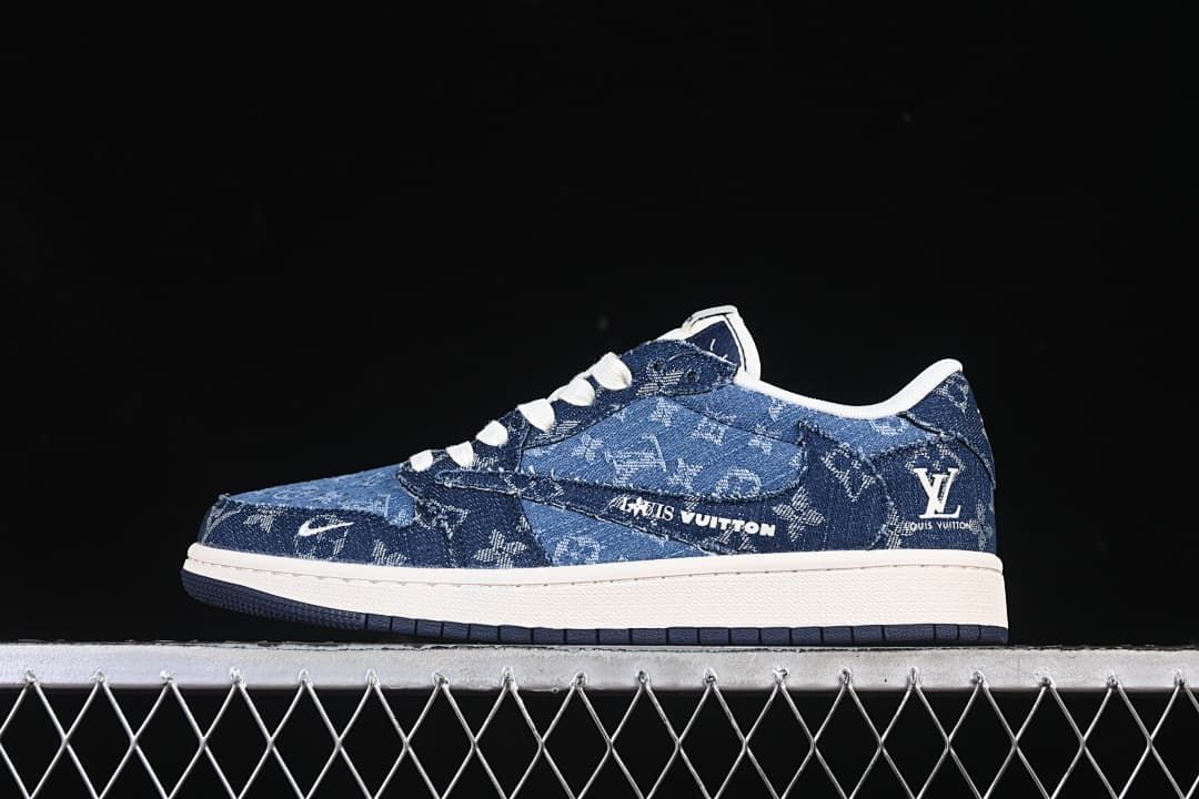 Side view of a dark blue patterned low-top sneaker with white graphics, white midsole, and dark outsole.