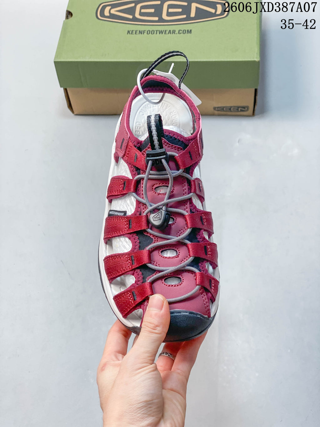 Top view of the sandal showing its open strap layout and toggle-laced cord.