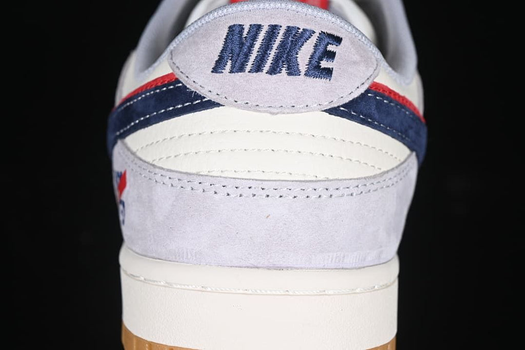 Rear view showing the Nike heel logo, layered panels and gum outsole.
