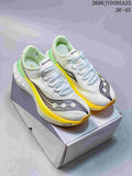 White Saucony Endorphin Speed 5 running shoes with yellow and green accents, displayed on a shoe box.