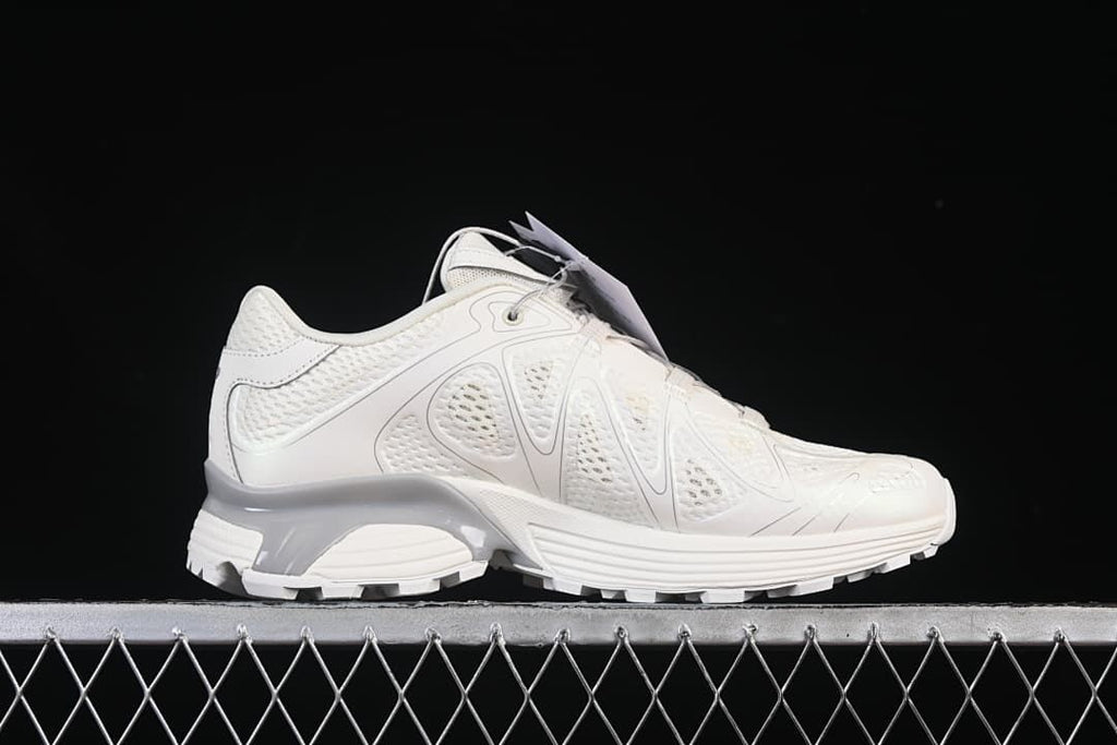 Side profile of one sneaker showing its mesh upper and sculpted sole