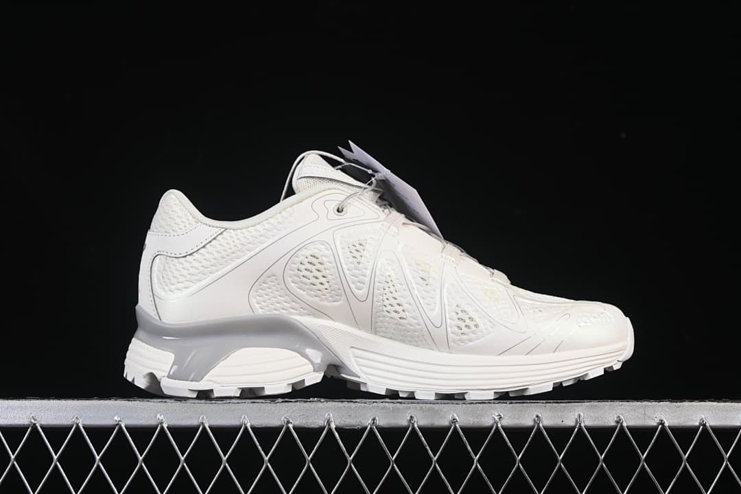 Side profile of one sneaker showing its mesh upper and sculpted sole