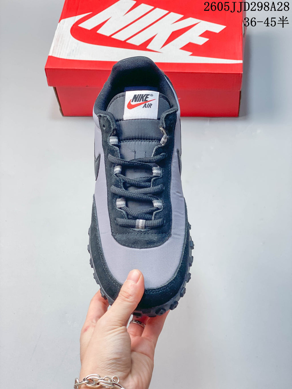 Top view of a gray and black lace-up sneaker