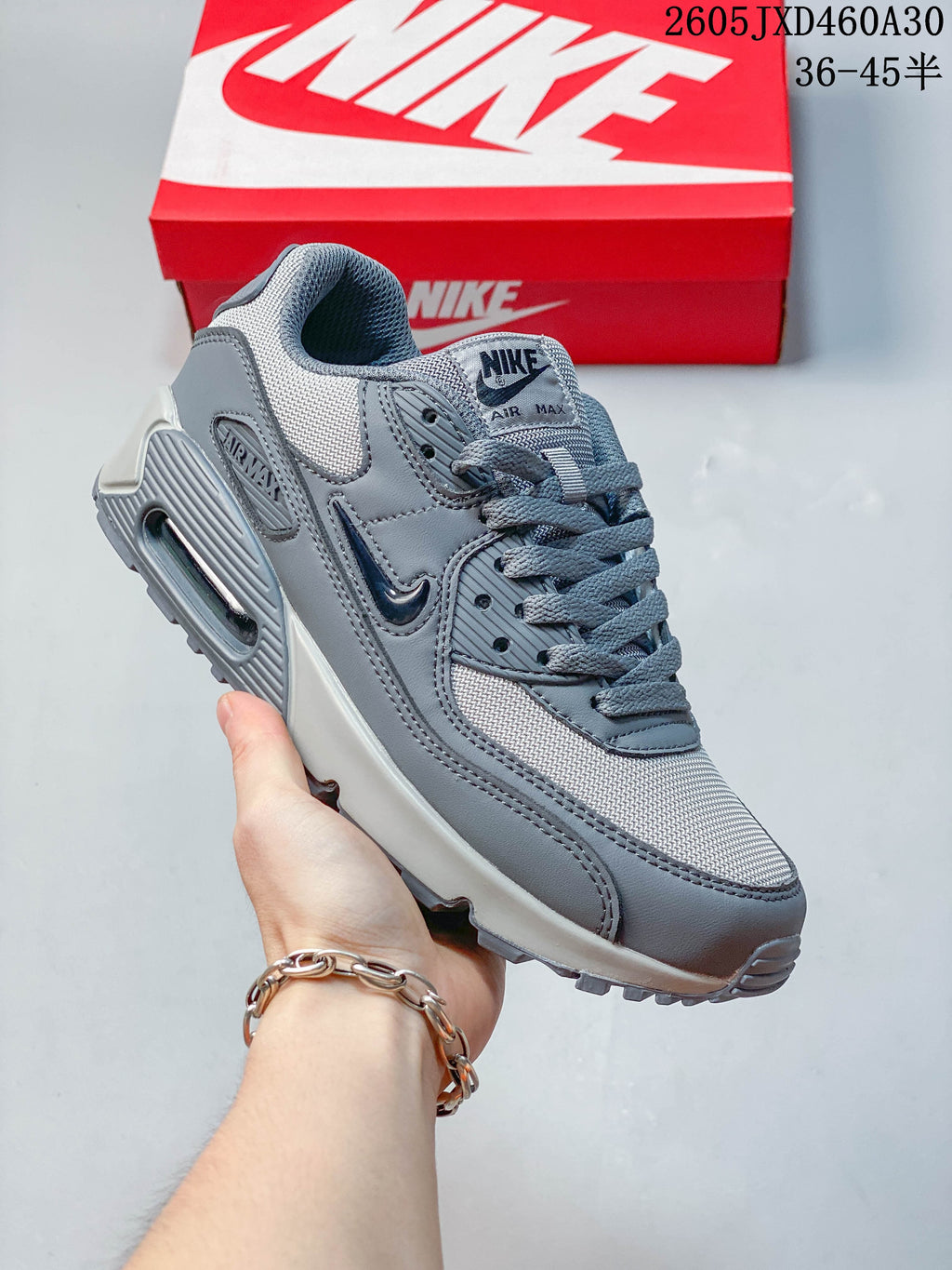 Gray Nike Air Max 90 sneaker with a visible heel Air unit