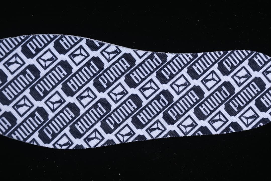 Insole with repeating Puma logos and cat emblems.
