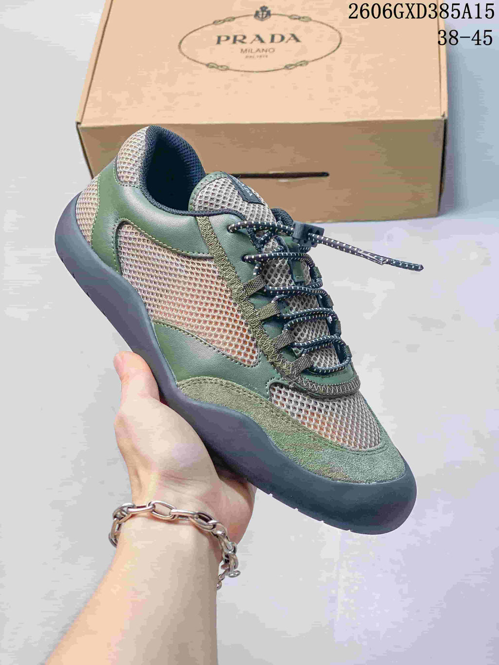 Close view of a green mesh-panel sneaker with lace-up fastening