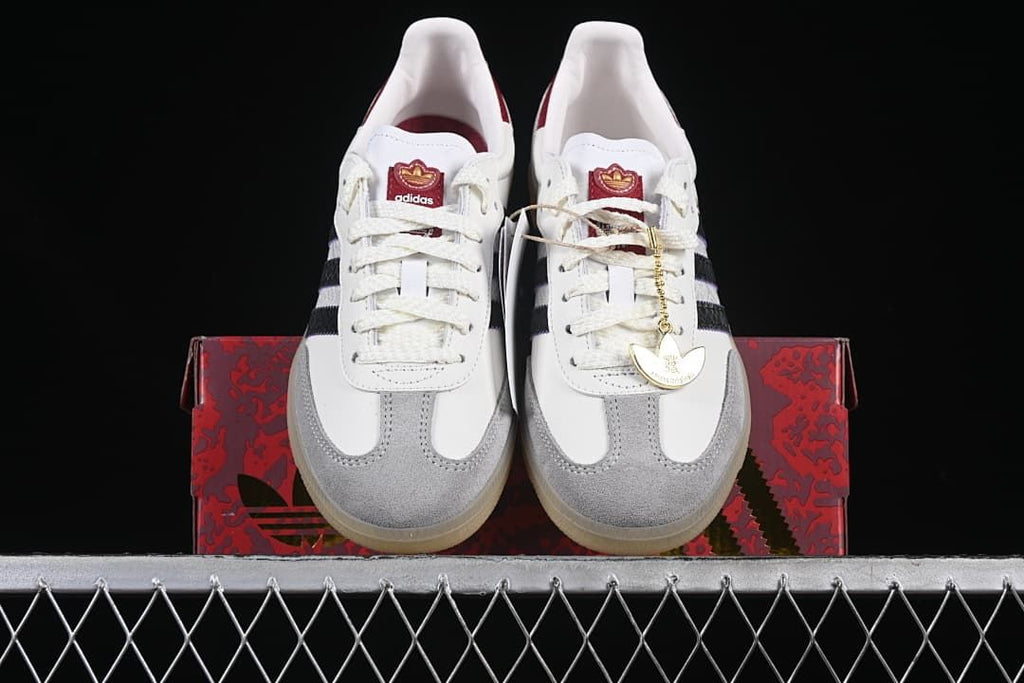 Front view of the pair displayed on a patterned red shoe box