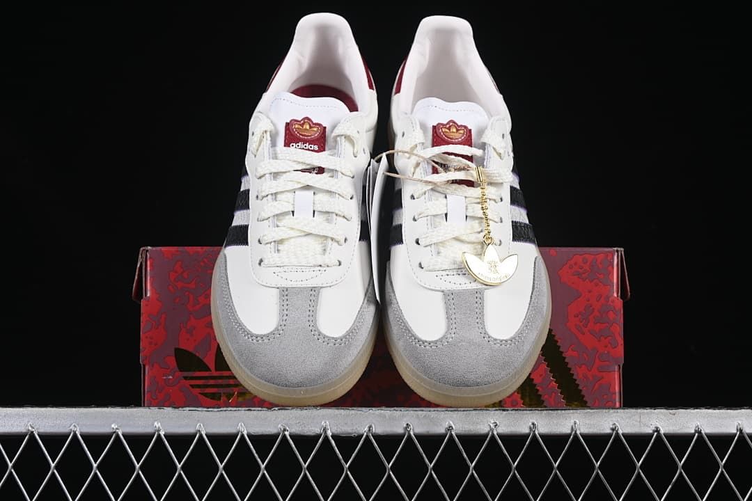 Front view of the pair displayed on a patterned red shoe box