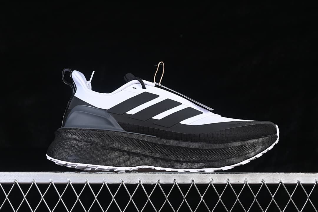 Side profile of the white and black running shoe