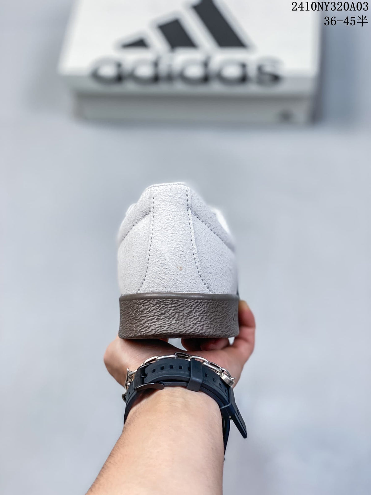 Rear view showing the light grey heel and brown-toned outsole