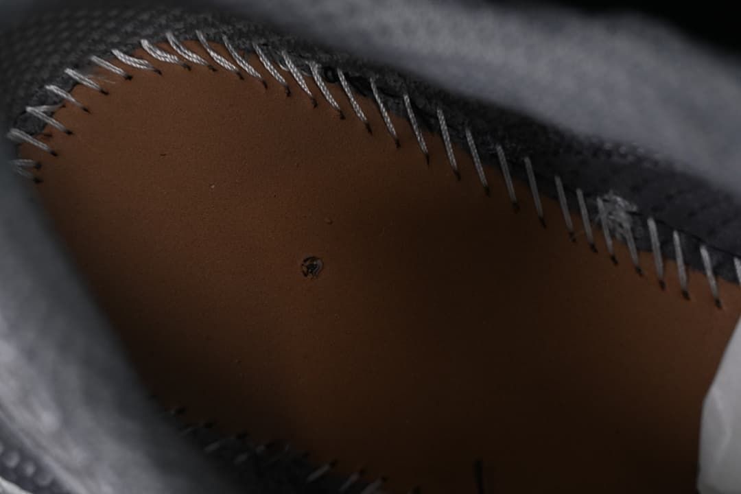 Close-up of the stitched interior underside of the shoe