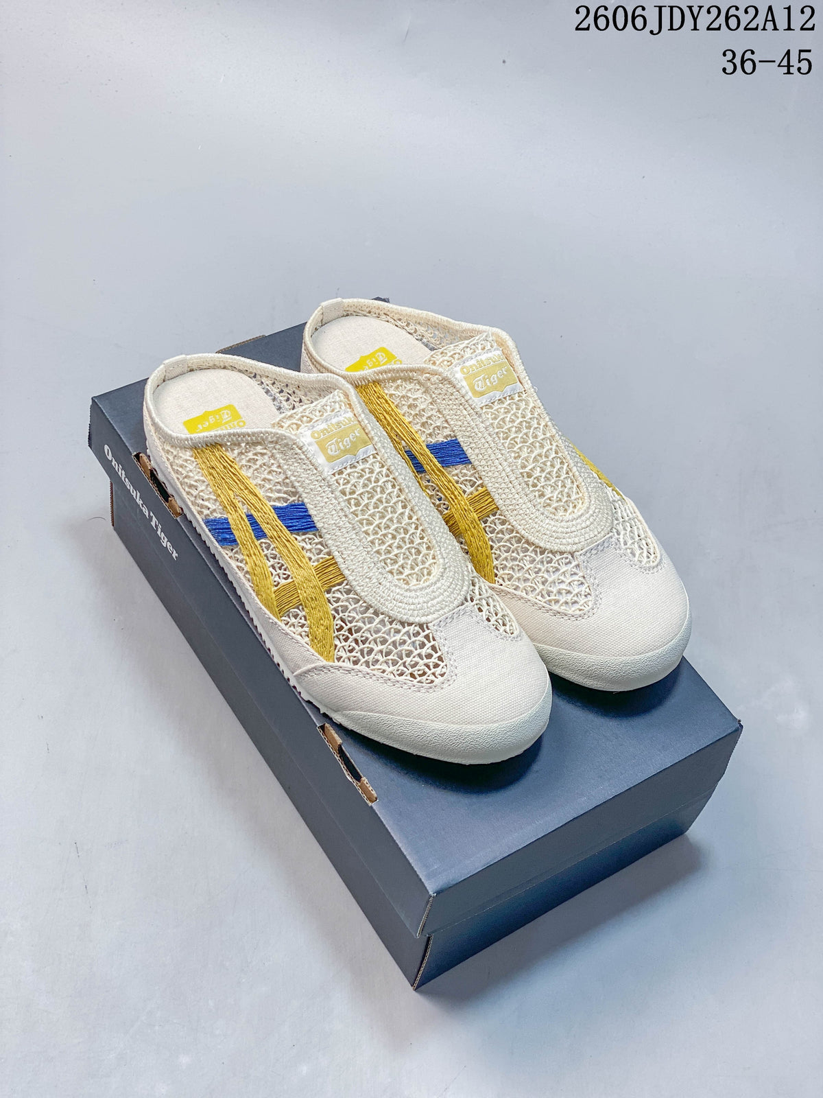 Pair of beige Onitsuka Tiger Mexico 66 Sabot slip-on shoes with yellow and blue stripes