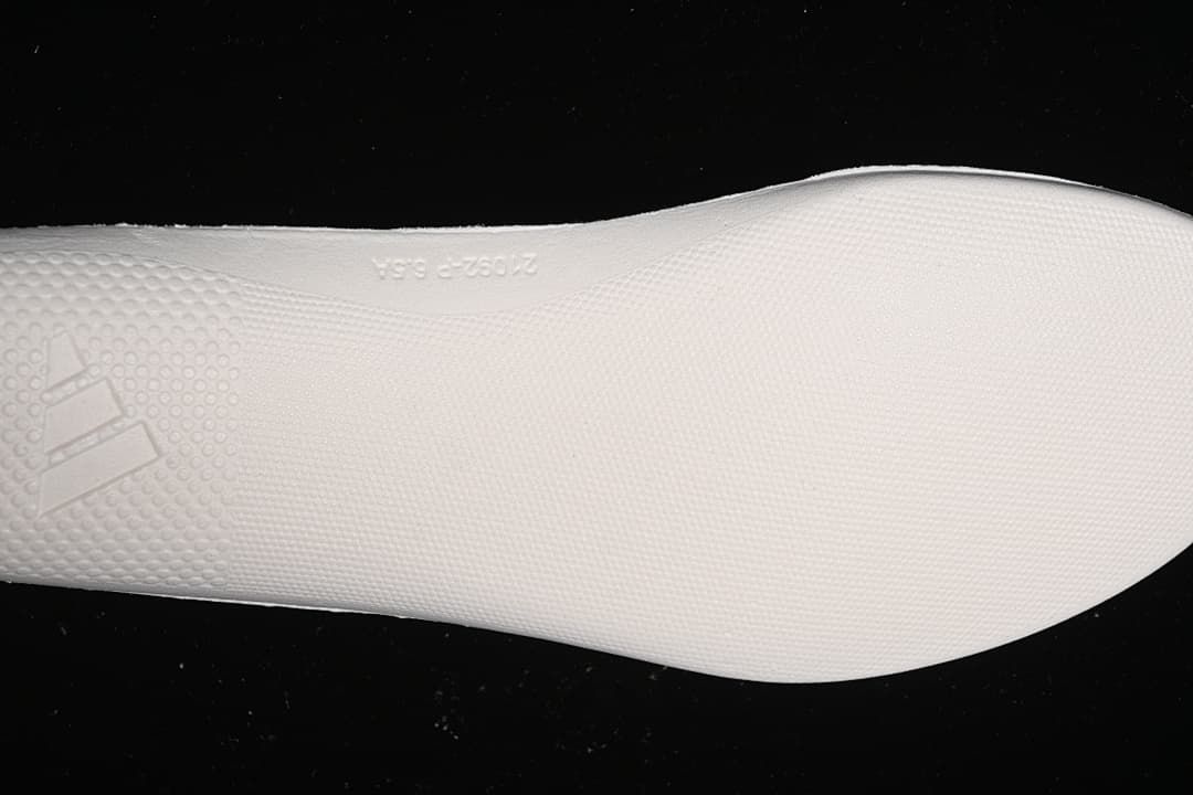 Close-up of the textured white outsole.