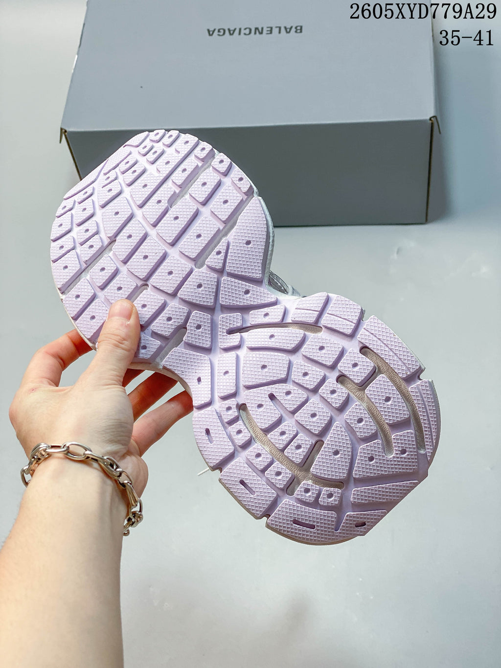Close-up of the lavender segmented outsole tread