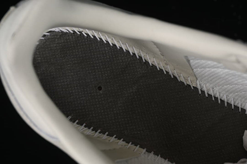 Close-up view inside the sneaker showing the insole and stitched inner construction