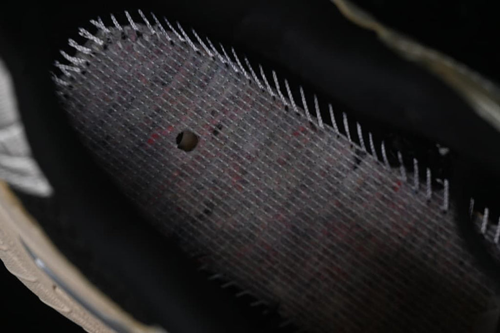 Close-up inside the shoe showing mesh lining and stitching