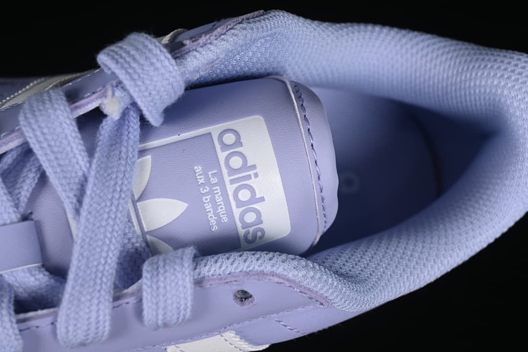 Close-up of the padded collar, laces, and Adidas tongue label