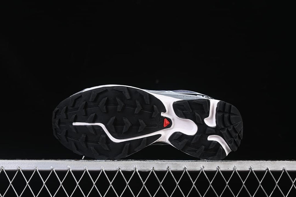 Underside showing the black lugged outsole