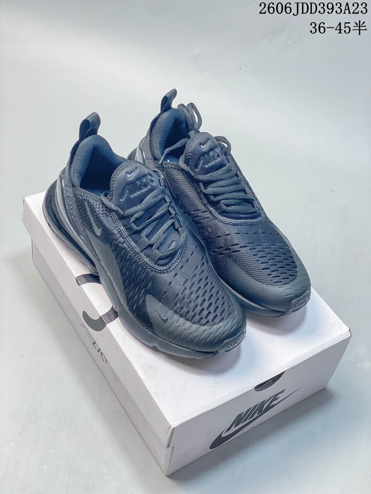Pair of dark gray Nike Air Max 270 sneakers shown on a shoebox