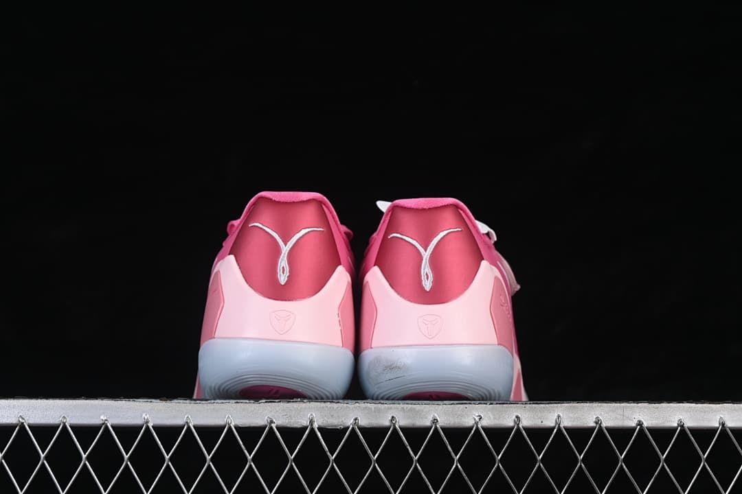 Rear view of both shoes showing heel logos and outsole