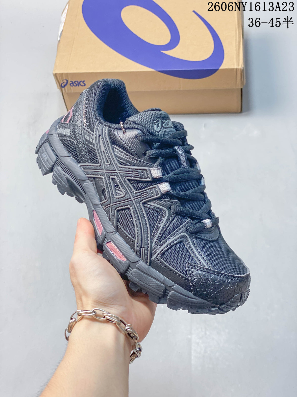 Angled side view of a charcoal ASICS Gel-Kahana 8 FL sneaker