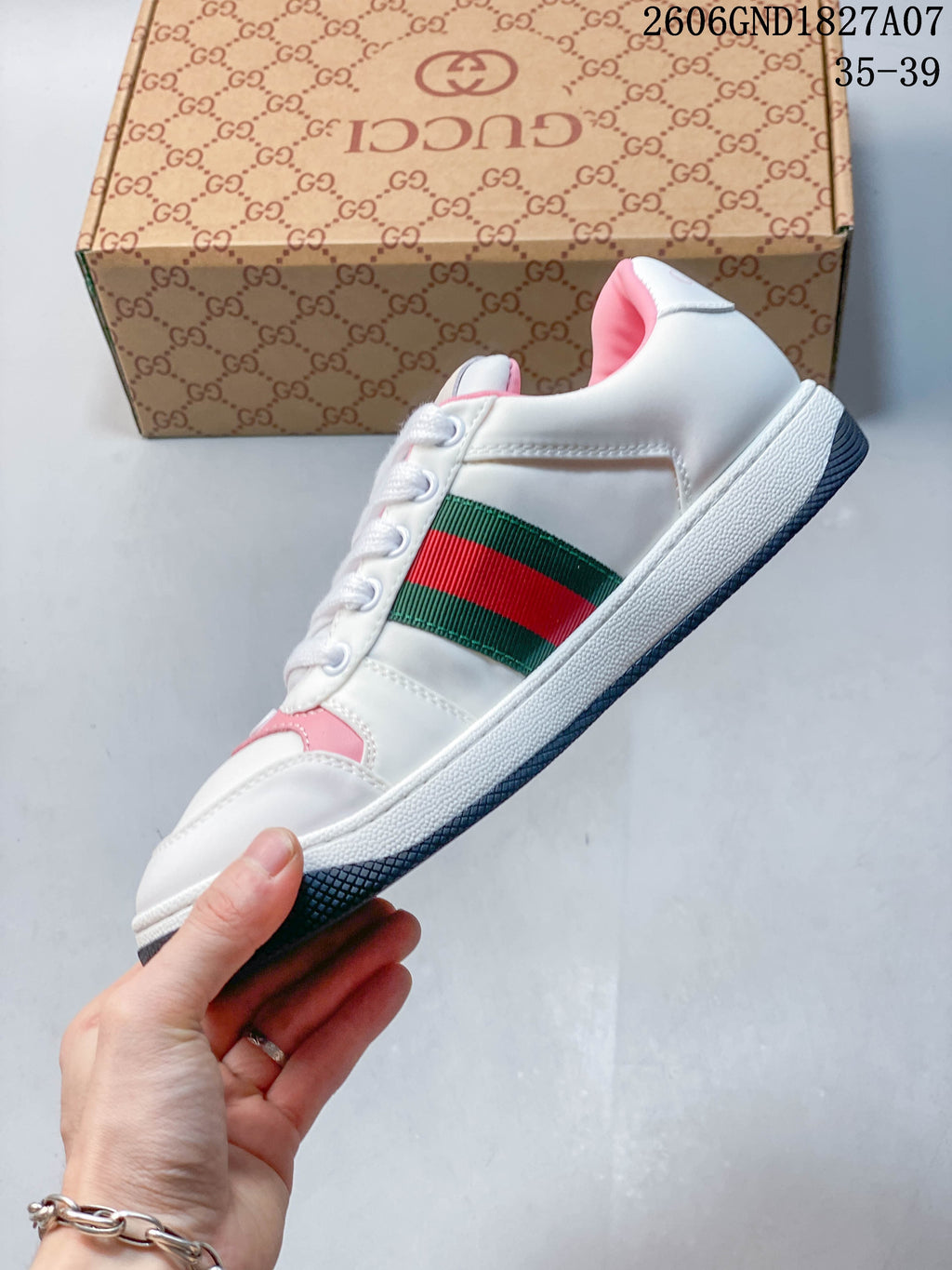 Side profile highlighting the green-and-red stripe and white sole.