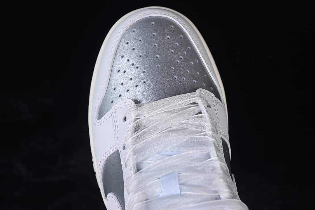 Top view of the perforated silver toe and laces