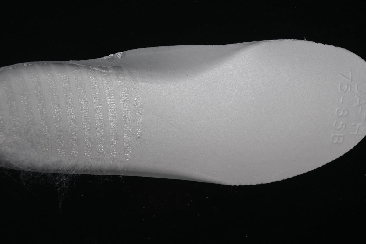View of the removable insole underside with embossed markings