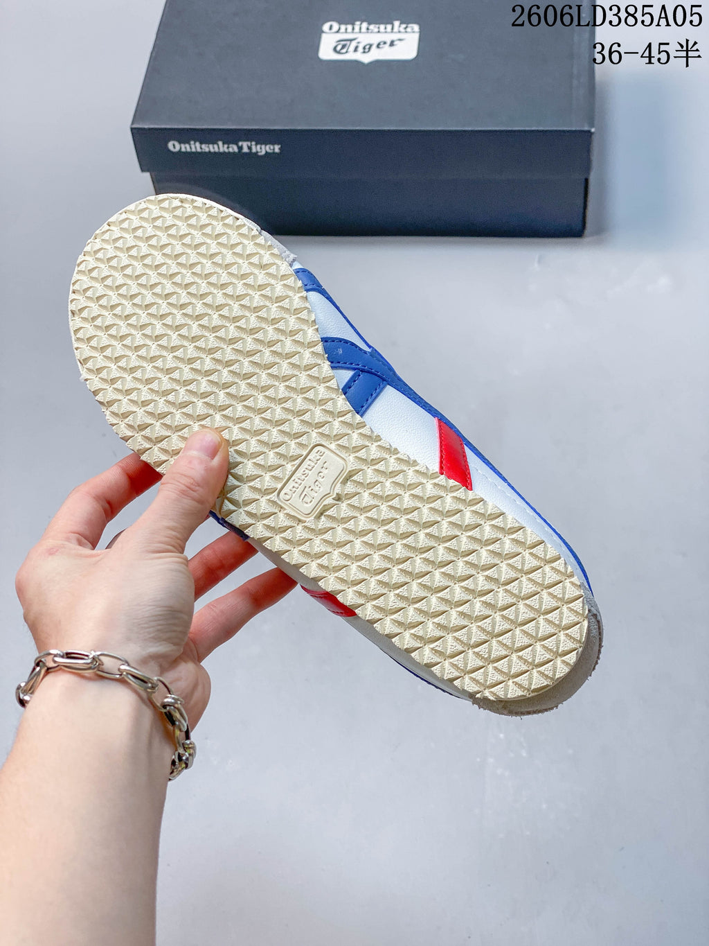 Textured off-white outsole of the Onitsuka Tiger Mexico 66 Deluxe sneaker.