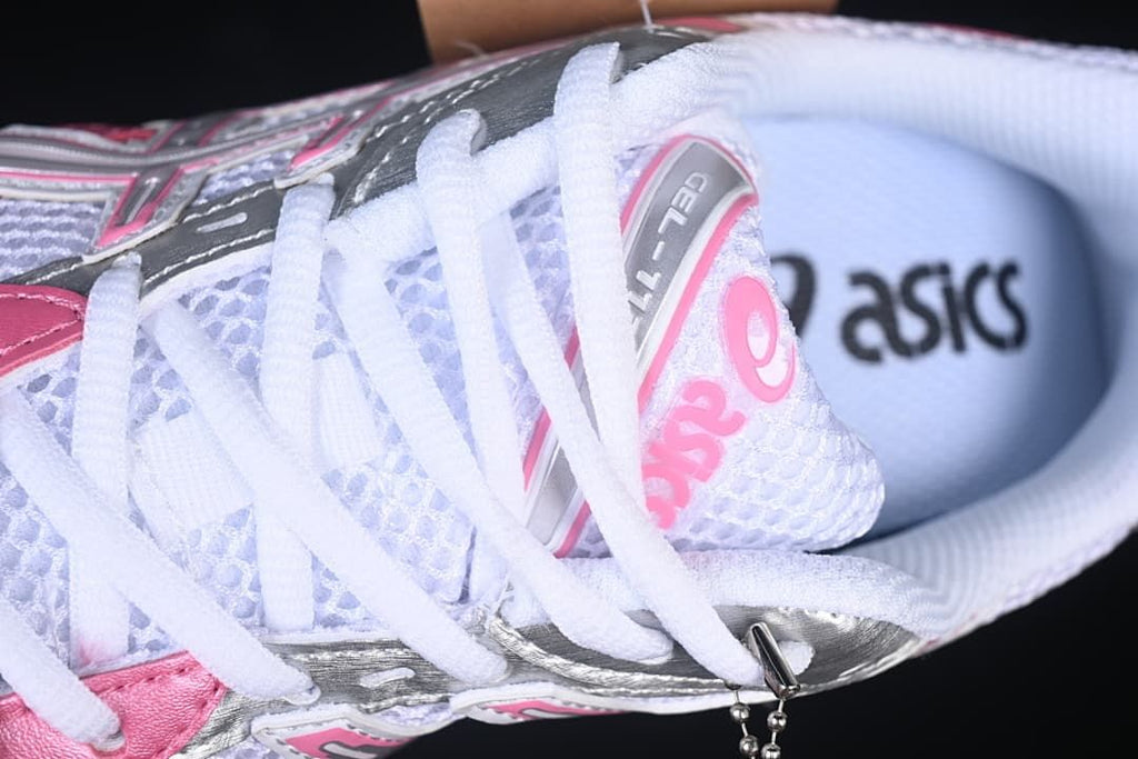 Close-up of laces, tongue branding, and mesh-look upper.