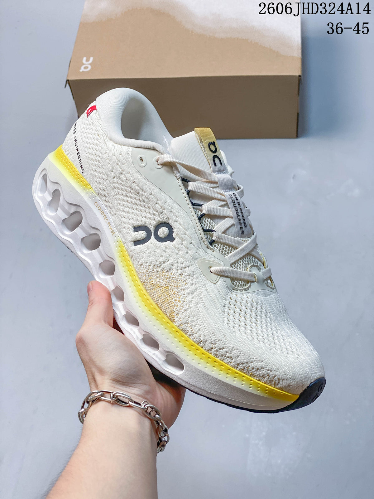 Side view of a white shoe with yellow accents and an open-channel midsole