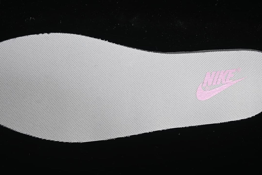 White insole with a pink Nike mark