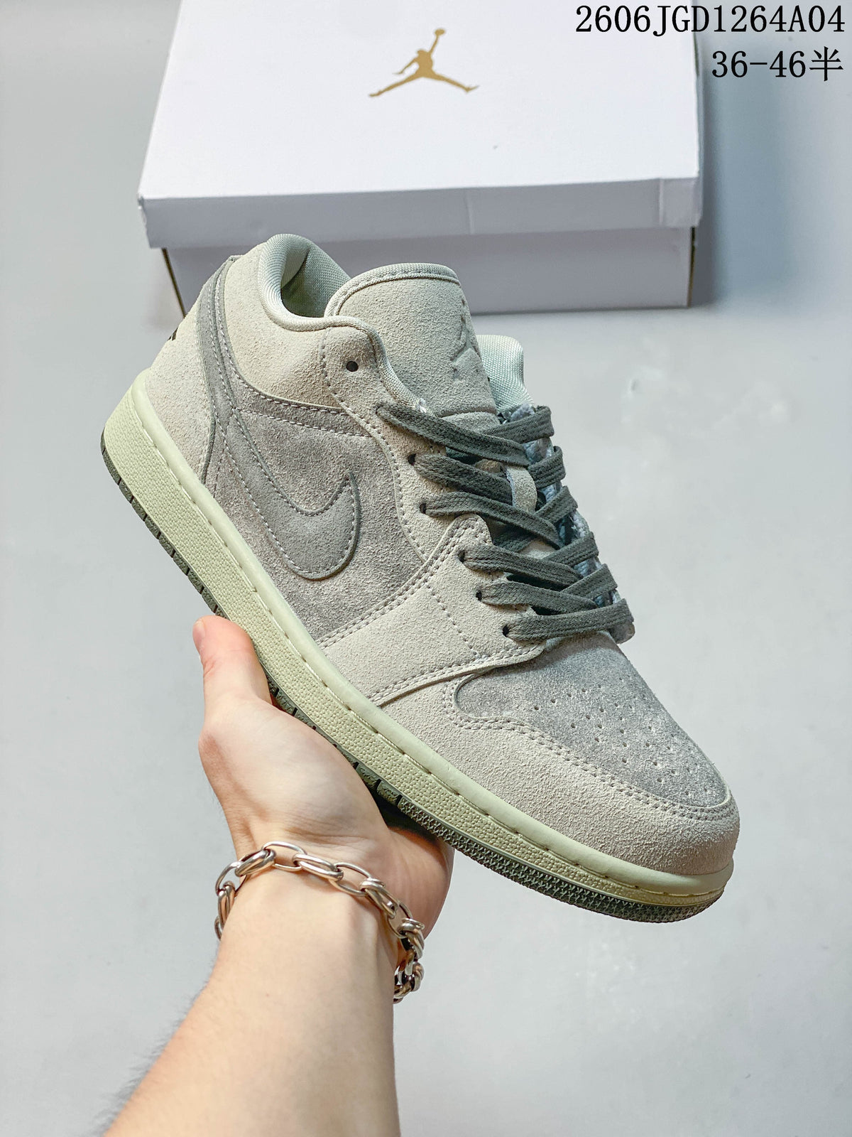 Side view of a pale gray Air Jordan 1 Low sneaker with gray laces