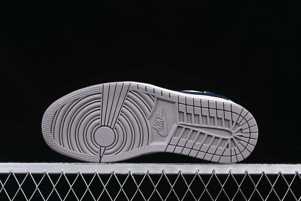 Grey rubber outsole with circular forefoot tread
