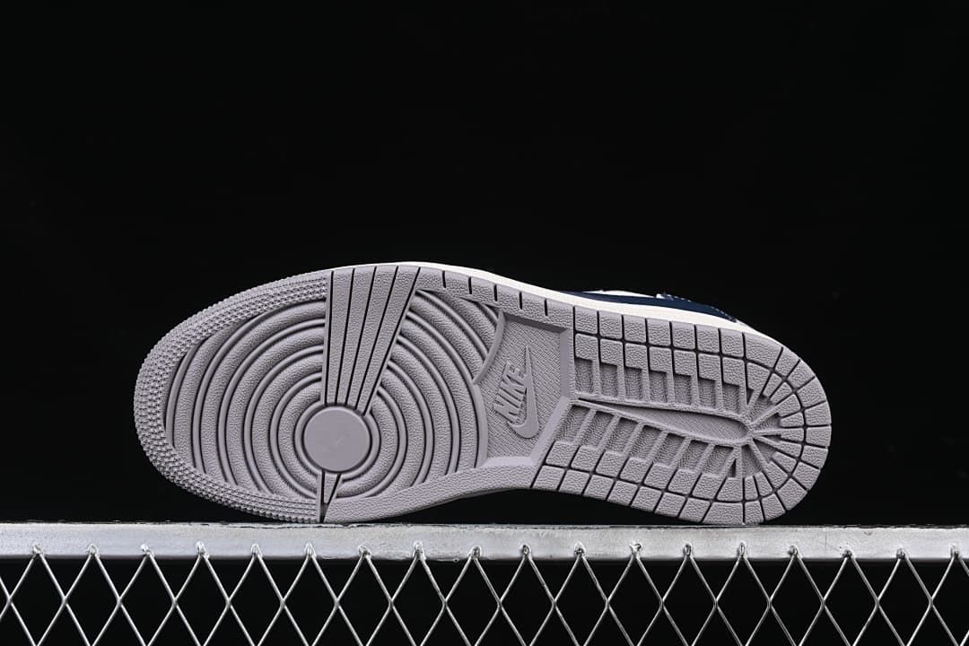 Grey rubber outsole with circular forefoot tread