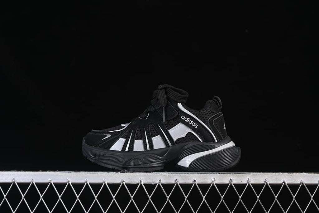 Black and silver Adidas Adistar kids sneaker shown in side profile