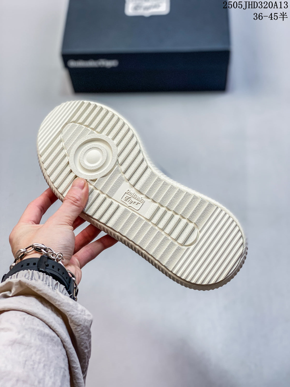 Underside of the sneaker showing a ridged cream-colored outsole