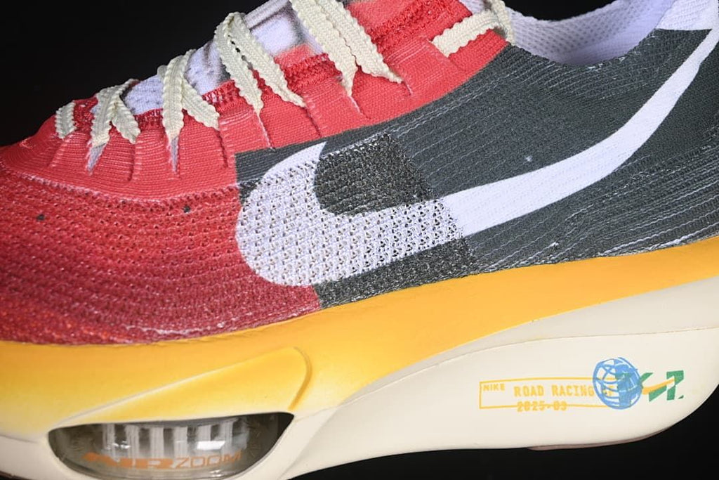 Close-up of side Swoosh, upper, and yellow sole edge