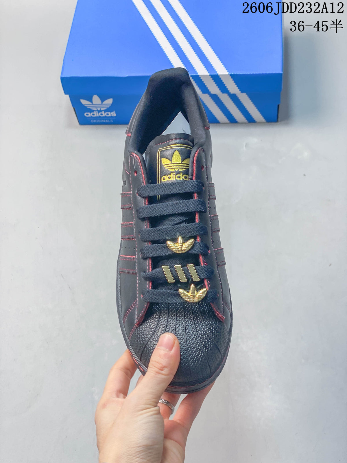 Top view showing the textured shell toe, laces, and gold-tone lace accents.