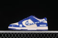 Side view of a blue and off-white Nike SB Dunk Low with a patterned Swoosh and contrasting side graphics.